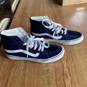 Woman’s blue high top Vans